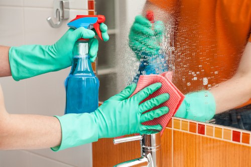 Carpet cleaning team preparing equipment with safety checks